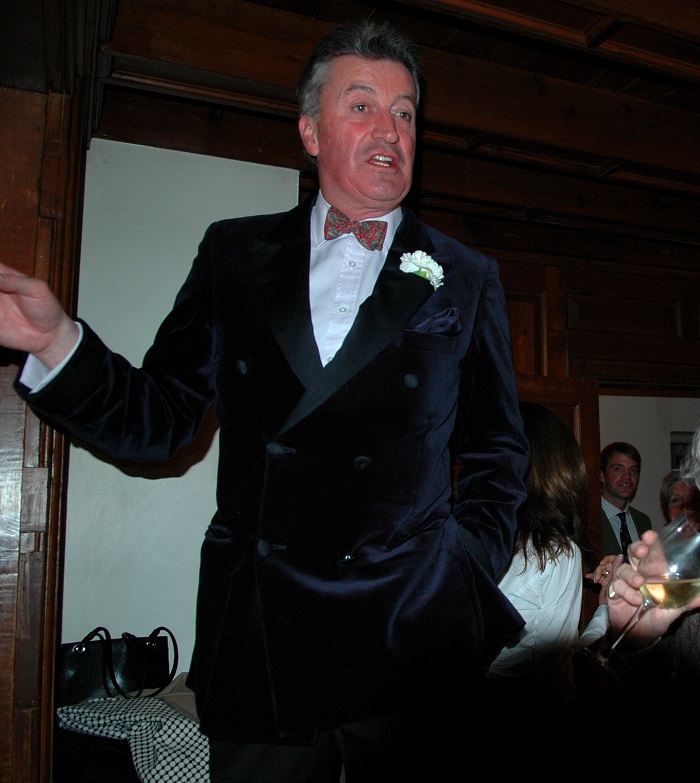  Aidan OConnell wearing his Frazers velvet smoking jacket welcoming his guests on his birthday at the Red Fox Inn in the USA