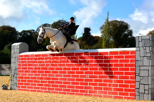 Susan Oakes jumping six feet  eight inches over wall